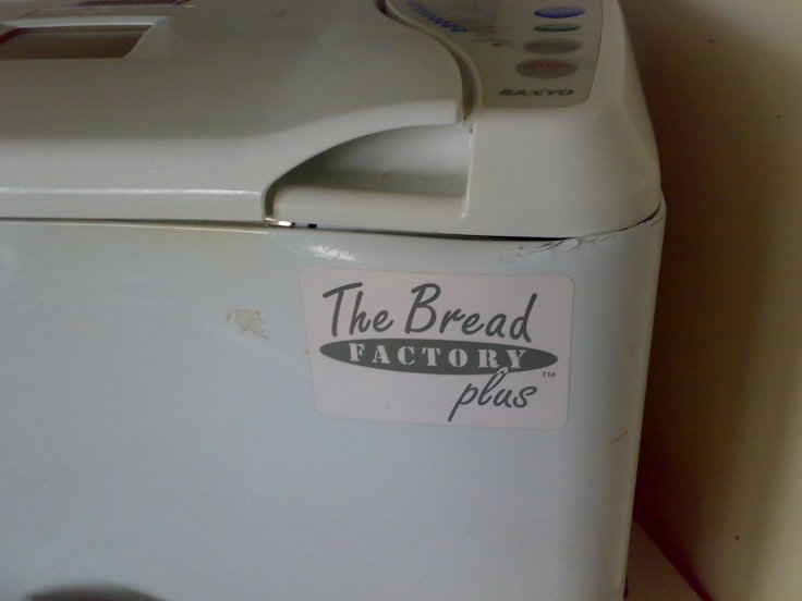 This dented bread machine needs to be covered with a thick towel when baking bread, to stop the draught that made uneven loaves. 