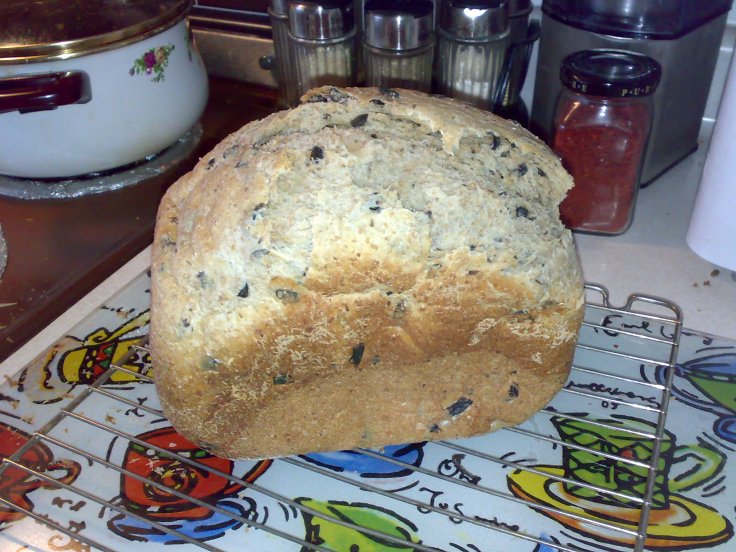 Olive brine adds flavour, and higher water-to-flour ratio makes this chewy, tasty loaf. 