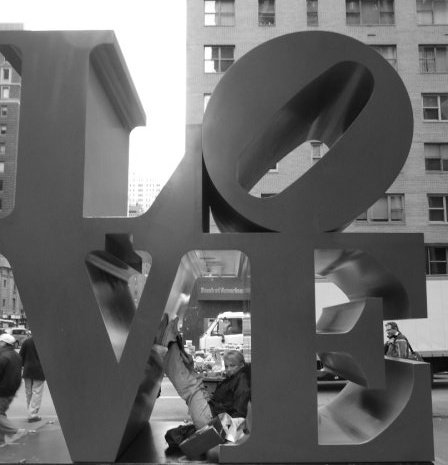 British singer Carolyn Fenna Arrowsmith  gets inside Robert Indiana's  LOVE sculpture in NYC. 